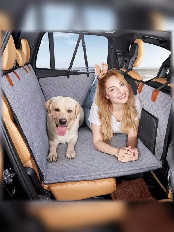 Gray pet car seat cover installed across a vehicle back seat