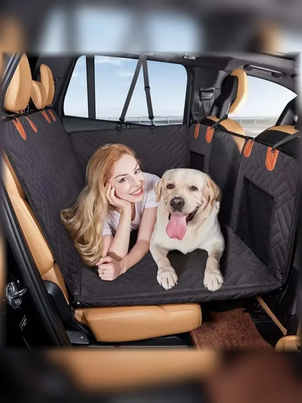 Black pet car seat cover installed across a vehicle back seat