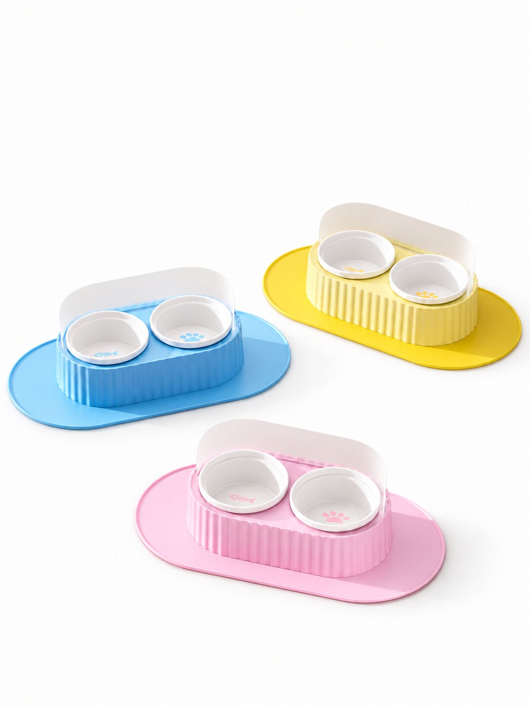 Slanted Cat Bowl Main Image Slanted ceramic cat bowls with mats in blue, yellow, and pink