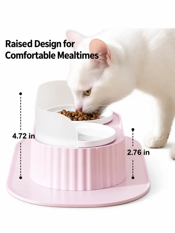 White cat eating from a pink raised slanted cat bowl